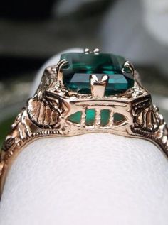 Natural Green Emerald 10k or 14k Rose Gold RingLovely Rectangle Design#D148 Make heads turn and stand out with this gorgeous piece of jewelry! This Edwardian reproduction filigree ring is made from rose gold and features an emerald cut high quality natural emerald gemstone measuring 9mm by 7mm. From the beautiful intricate floral daisy design to the inside of the band marked 10K or 14K for gold – this ring will take your look to the next level! Look no further than this exquisite vintage-inspire Luxury Rose Gold 14k Gold Emerald Ring, 14k Gold Emerald Cut Art Deco Jewelry, 14k Gold Art Deco Emerald Cut Jewelry, 14k Gold Emerald Cut Art Deco Ring, Formal Rose Gold Emerald Jewelry, 14k Gold Art Deco Emerald Ring, Luxury 14k Gold Emerald Ring Rectangular Shape, Luxury 14k Gold Rectangular Emerald Ring, Luxury 14k Gold Emerald Ring With Rectangular Shape