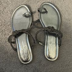 Size 9 Never Worn Jessica Simpson Sandals Chic Silver Flat Sandals, Silver Flat Sandals For Evening, Silver Synthetic Sandals For Evening, Elegant Silver Flat Sandals, Jessica Simpson Sandals, Jessica Simpson Shoes, Jessica Simpson, Black Sandals, Women's Shoes Sandals