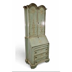 an old green painted cabinet with drawers