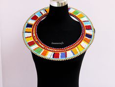 African beaded necklace, African jewelry, Masai necklace, Women jewelry, Christmas gift for her, Tribal necklace, Boho necklace A beautiful and unique piece of African beaded necklace which compliments any outfit. Necklace inner length : 18 inches Closure: Hook Color: White 3-5 days delivery via DHL Express Shipping fee is for the first item only and additional necklaces ship for FREE. To continue shopping click here: timanacrafts.etsy.com Handmade Multicolor Bridal Necklace With Round Beads, Traditional Necklaces With Colorful Beads For Gifts, Beaded Necklaces For Festivals As Gifts, Beaded Necklaces For Festivals And Gifts, Traditional Beaded Chain Choker, Traditional Necklace With Colorful Beads As Gift, Festival Gift Necklaces With Colorful Beads, Festive Necklaces With Colorful Beads For Gifts, Festival Gift Necklace With Colorful Beads