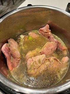 the meat is being cooked in the pot on the stove top, ready to cook