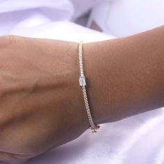 Add a touch of elegance to any outfit with our Emerald & Round White Cubic Zirconia Tennis Bangle Bracelet. Crafted from 925 sterling silver, this bracelet exudes sophistication and luxury. The perfect accessory for the refined woman, it combines the classic tennis bracelet design with a modern twist, featuring vibrant emerald and sparkling round white cubic zirconia stones. Elevate your style with this exquisite piece.Model No : CSBN11223-CZ Fine Jewelry Cubic Zirconia Bracelets For Gifts, Fine Gold Bracelet With Cubic Zirconia, Elegant Sparkling Diamond Bangle Bracelet, Fine Jewelry Sparkling Bracelet For Anniversary, Sparkling Fine Jewelry Bracelets For Anniversary, Elegant Diamond Bracelet With Si Clarity For Anniversary, Elegant Sparkling Diamond Bracelet As Gift, Elegant Sparkling Bangle Bracelet, Elegant Sparkling Diamond Bracelet For Anniversary