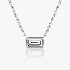 The Bezel Solitaire Necklace combines vintage-inspired detail and modern appeal together for a look that’s timelessly elegant. Baguette Necklace, Jewellery Showroom, Bespoke Rings, Solitaire Necklace, Solitaire Necklaces, Baguette Cut, Accessories Jewelry Necklace, Bezel Setting, Necklace Designs