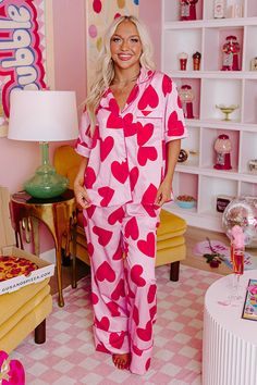 - Get your beauty sleep in these sweet pajama pants! - Unlined material with a pink heart print and accent piping - An elastic waistline - Functional side pockets - A relaxed silhouette that ends in straight hemline Pink Heart Print, Satin Pajama Pants, Satin Pajama, Candy Hearts, Beauty Sleep, Satin Pajamas, Heart Candy, Pajama Top, Women Clothing Boutique