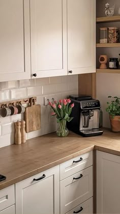 the kitchen counter is clean and ready to be used for breakfast or coffee makings