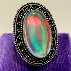 Beautiful Handmade Design Featuring A Bezel Set Mystic Fire Topaz Cabochon. Stamped 925 Mystical Silver Opal Ring For Anniversary, Collectible Silver Opal Ring, Mystic Fire Topaz, Cabochon Ring, Handmade Design, Bezel Setting, Womens Jewelry Rings, Topaz, Diamonds