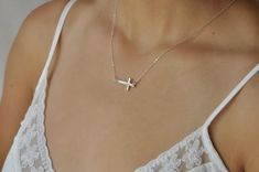 Our gift to you 10% off your first purchase. Details here - http:/eepurl.com/dpVPBzThis sideways cross necklace is stunning. It looks beautiful alone as you can see but it also looks gorgeous with our choker chain necklace, link below. Once you put this necklace on you won't want to take it off again!!....................DETAILThe cross is just under 1". Your choice of our signature 14 k gold fill or sterling silver chain. The gold cross is 24 k gold vermeil which gives it a wonderful deep rich Simple Everyday Cross Jewelry, Simple Cross Clavicle Chain Jewelry, Simple Clavicle Chain Cross Jewelry, Dainty Cross Necklace For Everyday, Wishbone Necklace Gold, Simple Choker Necklace, Christian Cross Necklace, Tiny Pearl Necklace, Choker Chain Necklace