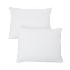 two white pillows sitting next to each other