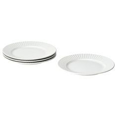 three white plates sitting on top of each other