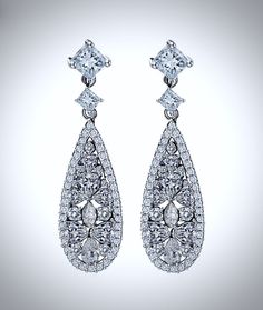 This delicate pair of earrings is adorned by flawlessly faceted cubic zirconia that capture the light from every angle with a perfectly translucent appeal, sparkling beautifully. Rhodium plated for a flawless finish which enhances the intricate detailing and conveys a modern take on old elegance, this exquisite design will add a touch of sophistication to any wedding gown or formal ensemble. Overall length of the earring is 40mm (approx. 1.5") and measures 12mm (approx. 1/2") wide. Hypoallergeni Elegant Bridal Earrings With Diamond Cut Crystal, Dazzling Crystal Earrings With Diamond Cut, Elegant Crystal Earrings With Diamond Cut Cubic Zirconia, White Crystal Diamond-cut Earrings, White Crystal Diamond Cut Earrings, White Diamond Cut Crystal Earrings, Glamorous Cubic Zirconia Diamond Earrings For Formal Occasions, Formal Cluster Earrings With Sparkling Stones, Formal Cluster Earrings With Sparkling Cubic Zirconia