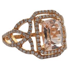 This collection features an array of magnificent morganites! Accented with Diamond these rings are made in rose gold and present a classic yet elegant look. Classic morganite ring in 18K Rose gold with Diamond. Morganite: 1.99 carat, 9X7mm size, cushion shape. Diamond: 0.564 carat, 1.00mm size, round shape, G color, VS clarity. Gold: 4.49g, 18K Rose Gold. R720 Morganite Ring, Morganite, 18k Rose Gold, Round Shape, Fashion Rings, Diamond Engagement, Diamond Engagement Rings, Diamond Ring, Jewelry Rings