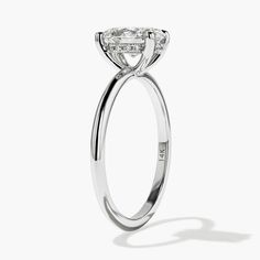 Center Stone: Oval Shape Lab Grown Diamond Certificate: 1.10ct | G | SI1 | Excellent Cut | USA Grown | View Accenting: 0.06ctw Lab Grown Diamonds Metal:14k Recycled White Gold Current Ring Size: 6 Band Width: 1.5mm This Ready-to-Ship Millie Engagement Ring is set with a 1.10ct Oval Cut Lab Grown Diamond center stone in recycled 14K White Gold, Size 6(any other size selected will require resizing). The center stone is accented by a hidden halo of 0.06ctw Lab Grown Diamonds on a delicate, plain me Gia Certified Oval Diamond Halo Ring, Gia Certified Oval White Gold Diamond Ring, Certified Oval Diamond Halo Ring, Gia Certified Oval Diamond Ring In Diamond White, Gia Certified Moissanite Diamond Ring Marquise Cut, Dazzling Oval Lab Grown Diamond Ring, Gia Certified Timeless Marquise Cut Wedding Ring, Solitaire Oval Lab Grown Diamond Rings, Gia Certified Oval Lab Grown Diamond Ring