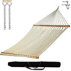 a white hammock hanging from a chain with two hooks and a black bag