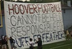 a large sign on the side of a football field that reads hoover football cannot be released responsible