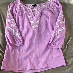 Brand New Without The Tags(I Accidentally Pulled The Tag Off) Light Violet And White Trim Beautiful Lightweight Flowy Boho Embroidered Blouse. Brand New Without Tags Excellent Condition 100% Cotton Casual Purple Blouse With Floral Embroidery, Casual Embroidered Purple Blouse, Casual Purple Embroidered Blouse, Spring Purple Embroidered Cotton Top, Spring Vacation Embroidered Shirt, Purple Casual Embroidered Top For Spring, Casual Purple Embroidered Top For Spring, Casual Purple Top With Floral Embroidery, Casual Purple Floral Embroidered Top