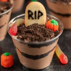 halloween desserts in plastic cups decorated with chocolate and candy