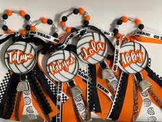 an assortment of sports themed lanyards with name tags