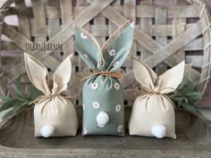 three small bags with bunny ears tied to them