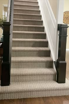 Herringbone pattern carpet stair runner in light brow n and cream with dark wood stair railing and white wall trim. Stairs Landing Decor, Landing Decor Ideas, Herringbone Stair Runner, Carpet Stair Runner, Carpet Options, Black Stair Railing, Landing Decor