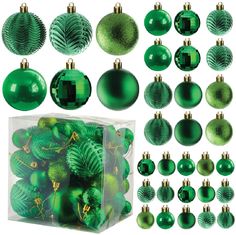 green christmas balls and ornaments are in a clear box