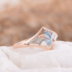 "Anniversary ring, Art deco ring, Topaz ring, Marquise ring, Women ring, Geometric ring, Rose gold ring, Elegant ring, Delicate ring WE OFFER UNLIMITED PERIOD INSTALLMENTS PLAN This is a beautiful, stunning, feminine ring that works well for all occasions, styles, and ages. You will love it! Same ring in white gold: https://www.etsy.com/listing/294832061/topaz-ring-art-deco-ring-gemstone-ring?ref=shop_home_active_1 Ring information: Main stone: Swiss Topaz Approximate size: 6*3 mm Accent stone: Fine Jewelry Marquise Rings As Gift, Fine Jewelry Marquise Rings For Gift, Art Deco Blue Topaz Ring With Center Stone, Art Deco Open Ring For Anniversary, Fine Jewelry Marquise Birthstone Ring, Rose Gold Topaz Ring With Diamond Accents, Art Deco Rose Gold Ring With Gemstone, Marquise Topaz Ring For Promise Occasion, Marquise Topaz Promise Ring