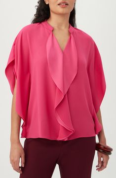 A cascading front ruffle and elegantly draped sleeves bring sophisticated appeal to a flowy crepe top cut in a boxy silhouette. Split neck Three-quarter sleeves 67% recycled polyester, 33% polyester Machine wash, dry flat Made in the USA of imported fabric Draped Blouse With Ruffles, Elegant Draped Ruffle Blouse, Chic Formal Tops With Ruffle Sleeves, Elegant Summer Top With Cape Sleeves, Chic Tops With Draped Sleeves, Elegant Flutter Sleeve Blouse For Work, Spring Evening Pre-draped Tops, Chic Draped Spring Blouse, Elegant Tops With Ruffles And Butterfly Sleeves