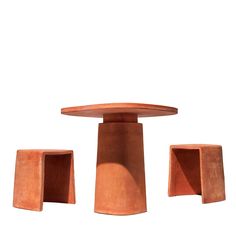 three pieces of wood sitting on top of each other in front of a white background