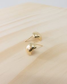 details: high shine polished minimal studs in 18k solid yellow gold finish stud size approx. 11mm x 8.5mm total weight approx. 2.2g jumbo push backs Solid Yellow, Gold Finish, Yellow Gold, Stud Earrings, Yellow, Gold