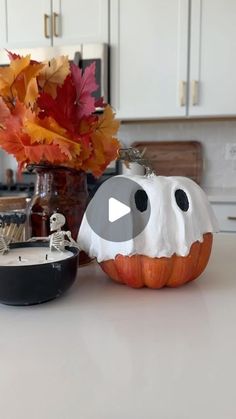 a white counter top topped with a pumpkin