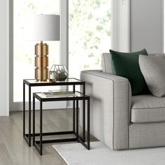 a living room scene with focus on the end table and sofa in the foreground