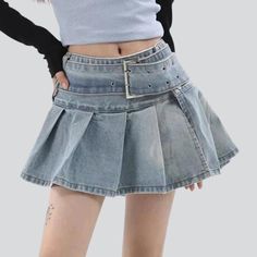 Introducing our ultra mini pleated denim skirt from the 2023 Summer Collection ââ‚?a timeless nod to the '90s. with a modern twist!Why It's Your Next Summer StapleThis 90s-inspired skirt reflects a perfect balance of modern fashion and nostalgia. With its lower-waisted silhouette. light wash. and subtle pleats. you'll add a touch of edginess to any ensemble. Plus. it's made with premium quality denim for a elongated-lasting wardrobe staple.Key Highlights: Nostalgic Vibes: A tribute to the iconic Trendy High-waist Skort For Streetwear, Trendy High Waist Skort For Streetwear, Y2k High Waist Mini Skirt For Streetwear, Y2k High Waist Skirt With Belt Loops, Y2k Streetwear Skirt, Punk High-waist Denim Skirt With Pockets, Trendy Short Skirt With Belt Loops, Punk Style Mini Length Bottoms With Pockets, Punk Mini Length Bottoms With Pockets