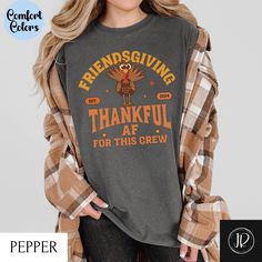 Celebrate your Friendsgiving in style with our "Thankful AF for This Crew" Comfort Colors® Friendsgiving shirt! Perfect for a Thanksgiving gathering or Friendsgiving celebration, this soft and durable group t-shirt is a must-have for showing appreciation for your crew. Whether you're with friends or family, this matching shirt will add cozy vibes to any family gathering or Friendsgiving party. See our other designs at https://jollyrodgerscreation.etsy.com  Welcome to Jolly Rodgers Creations! We' Thanksgiving Cotton T-shirt With Crew Neck, Fall Crew Neck Shirt With Custom Print, Cotton Crew Neck T-shirt For Thanksgiving, Thanksgiving Graphic Print Crew Neck T-shirt, Fall Custom Print Shirt With Relaxed Fit, Fall Season Relaxed Fit Shirt With Custom Print, Custom Print Shirt With Relaxed Fit For Fall, Fall Relaxed Fit Shirt With Custom Print, Relaxed Fit Shirt With Custom Print For Fall