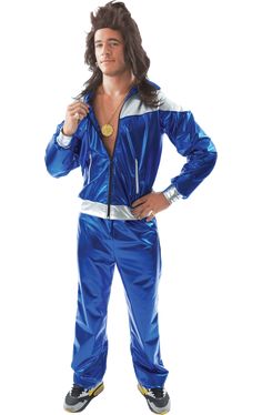 a man in a blue and white track suit posing for the camera with his hands on his hips