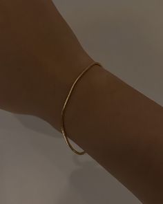 The slinkiest and daintiest bracelet that you can wear every day for that barely-there look. Featuring a 2mm width 18k gold-filled snake chain that can easily be stacked. Tarnish-resistant, showerproof, and safe for sensitive skin. …………………………………. D E T A I L S • Snake chain width measures 2mm• Snake chain length measures 6.5"/16.5cm• Spring clasp• Tarnish-resistant, waterproof, and safe for sensitive skin • 18K Gold Filled Minimalist Everyday Flexible Gold Bracelet, Everyday Minimalist Flexible Gold Bracelet, Minimalist Flexible Gold Bracelet, Adjustable Snake Chain Gold Bracelet For Everyday, Adjustable Dainty Snake Chain Bracelet, Dainty Adjustable Snake Chain Bracelet, Gold Snake Chain Jubilee Bracelet For Everyday, Everyday Gold Snake Chain Jubilee Bracelet, Everyday Gold Snake Chain Bracelet, Tarnish Resistant