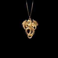 Unleash your inner fire with our Dragon pendant. Crafted with exquisite detail, this powerful piece embodies the untamed strength and mystique of the dragon, a symbol of wisdom and fierce protection. Feel the energy of this ancient guardian as it wraps you in its embrace, reminding you of your own unyielding spirit and the burning passion within. PENDANT INFORMATIONThis pendant is made of real, solid gold.• Made in USA• Material: 14k or 18k solid gold• Finish: polished• Height: 1.3" (33 mm) x Wi Gold Dragon Jewelry, Gold Dragon Necklace, Dragon Woman, Burning Passion, 2024 Moodboard, Bronze Dragon, Phoenix Pendant, Symbol Of Strength, Rhaenyra Targaryen