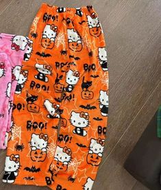 Sanrio Hello Kitty Pajama Pants provide maximum comfort with a stylish design. These cotton blend pants feature an elastic waistband, as well as Sanrio's iconic Hello Kitty character. Perfect for a comfortable night in or a lazy day lounging around. Halloween Pyjama Pants, Hello Kitty Pjs Halloween, Halloween Hello Kitty Pants, Halloween Pjs Pants, Cozy Halloween Outfits, Cute Halloween Pajama Party Sleepwear, Cute Cartoon Print Bottoms For Sleepover, Cute Halloween Sleepover Sleepwear, Halloween Pj Pants