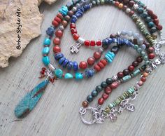 Colorado Springs, Boho Style Me Colorful Rustic Style Multi Strand Gemstone Necklace, BohoStyleMe, Artisan Beaded Turquoise Necklace In the style of the rustic Colorado mountains, this colorful, rustic, mixed gemstone necklace stands out as a striking multiple strand statement necklace. Starting with a beautiful chrysocolla beaded pendant is a trail of genuine turquoise, lapis lazuli, carnelian, labradorite, iolite, sodalite, and a large mix of jasper stones. Directly above the pendant is strand with a row of gorgeous lapis disc beads, labradorite, and mixed jasper stones. The top strand holds a pewter templars cross, surrounded my additional gemstones. Pewter is used throughout, as well as mixed silver metal - enjoy! Length - 30 inches (longest), 24 inches (shortest). Chrysocolla pendant Bohemian Blue Beaded Necklaces With Stones, Blue Bohemian Beaded Necklaces With Stones, Multicolor Bohemian Turquoise Necklace With Stones, Bohemian Multicolor Turquoise Necklace With Stones, Bohemian Beaded Turquoise Necklace For Meditation, Multicolor Turquoise Bohemian Necklace, Bohemian Multicolor Turquoise Necklace, Bohemian Turquoise Necklaces With Stones, Bohemian Turquoise Stone Necklaces