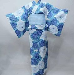 Yukata; This Japanese cotton kimono yukata features wave on a white background. Wear this beautiful robe on summer day or hang it as a display to admire daily. Item: Yukata Cotton Kimono / Obi belt is not included. No.ktm145 Size: US  M-L   /  Length  64 inch (163cm) , Width 26.7 inch (68cm). Condition: NEW. Please check the photos. Need a Obi Sash? Find it here: https://www.etsy.com/shop/KimonoFujiyamarock?ref=seller-platform-mcnav&section_id=13757607 Shop the entire collection https://fujiyama Blue Kimono Traditional, Blue Yukata, Kimono Ideas, Kimono Traditional, Obi Sash, Kimono Obi, Cotton House, Kimono Japanese, Kimono Yukata