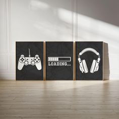 three canvases with gaming controllers on them in front of a white wall and wooden floor