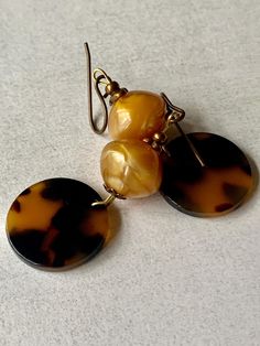 Acetate, tortoiseshell disc earrings with vintage lucite drops in buttered toffee. Lightweight, delicious earrings which hang 5cm from vintaj ear wires. Butter Toffee, Disc Earrings, Vintage Lucite, Toffee, Tortoise Shell, Ear Wires, Favorite Jewelry, Jewelry Earrings Dangle, Caramel