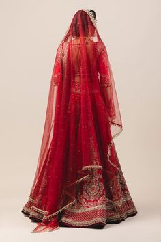 Red 14-panelled raw silk lehenga with zardozi embroidery. Comes with blouse, net dupatta and embellished veil.
Component: 4
Embroidered
Neckline: V Neck
Sleeve Length: Long
Fabric: Lehenga and blouse: Raw Silk; Dupatta: Soft net; Veil: Tulle
Color: Red
Plunging neck
Bead tassels
Cutout back - Aza Fashions Traditional Red Gown With Dupatta, Red Gown With Intricate Embroidery And Traditional Drape, Traditional Red Gown With Cutdana Details, Red Embroidered Gown For Diwali, Embroidered Red Gown For Diwali, Traditional Red Gown With Drape, Traditional Red Gown With Resham Embroidery, Red Anarkali Set With Dupatta For Reception, Traditional Red Gown With Traditional Drape