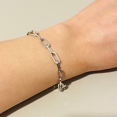 "Sterling Silver PAPERCLIP bracelet . link silver bracelet . clip bracelet . paperclip bracelet . 925 Rhodium plated Sterling Silver . Material:  Guaranteed 925 Sterling Silver, Rhodium plated finish . Link size:   .20 x .40\" (5 x 10.8mm) . Bracelet length:  7\" (19cm) . Weight: 7.3 grs . Dainty and modern design . Comes in a reusable gift box Please send me a message if you want more details or photos of this bracelet Please follow my Instagram account  @maimaiandco Thank you very much for loo Everyday Silver Link Chain Bracelet, Classic Paperclip Bracelet With Oval Link Silver Chain, Classic Silver Chain Paperclip Bracelet With Oval Links, Silver Chain Bracelet With Paperclip Link, Classic Silver Paperclip Bracelet With Oval Links, Silver Chain Bracelet With Rectangular Links For Everyday, Everyday Sterling Silver Chunky Chain Bracelet, Classic Silver Chain Link Paperclip Bracelet, Modern Oval Link Paperclip Bracelet With Silver Chain