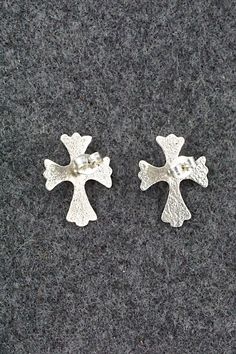 These turquoise and sterling silver cross shaped earrings were made by Navajo silversmith Bruce Chee.Length: 3/4"Width: 1/2"Free shipping on all orders! We ship with USPS and always include tracking. All orders ship within a day of payment.Returns are accepted up to 30 days after you receive your order. Just send us a message. Our shop offers cash back or store credit. The item must be returned in new condition. Sterling Silver Cross, Silver Cross, Native American Jewelry, Turquoise Sterling Silver, Free Jewelry, Sterling Silver Earrings, Silver Earrings, Turquoise, Sterling Silver