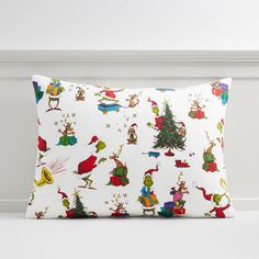 a white pillow with christmas decorations on it