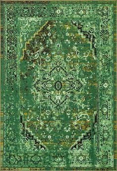 a green area rug with an ornate design