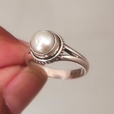 Elevate your style with our Natural Freshwater Pearl Ring, a stunning boho piece crafted from 925 sterling silver. This statement ring features a radiant white pearl, perfect for any occasion. A unique gift for women who love timeless, natural beauty. Shop now for a touch of elegance and authenticity!  PRODUCT DETAILS :- Gemstone :- Pearl Natural :- Yes Shape :- Round Cut :- Cabochon Metal :- 925 Sterling Silver Stamp :- Yes Ring Size :- All Sizes Available Every item will be delivered with a nice gift box Customization is available, We can also make it with 14k, 18k solid gold (white or yellow or rose) and diamond accent stone, just feel free to contact us. IMPORTANT: * Customer service is available 7 days a week * For wholesale discounts Feel free to contact us * All jewelry items will b Elegant Stackable Moonstone Ring In Sterling Silver, Elegant Stackable Sterling Silver Moonstone Ring, Bohemian Silver Stackable Rings For Anniversary, Bohemian Sterling Silver Jewelry For Anniversary, Bohemian Sterling Silver Stackable Jewelry, Bohemian Sterling Silver Moonstone Ring Nickel Free, Bohemian Stackable Sterling Silver Jewelry, Bohemian Sterling Silver Moonstone Ring, Bohemian Silver Stackable Rings With Gemstone