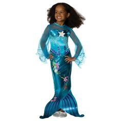 Your little girl will look fabulous under the sea when wearing the Magical Mermaid Toddler/Child Costume. This full length look is perfect for a cold Halloween night. The dress features an illusion neckline that matched the long flowing sleeves. Nautical designs are printed right onto the gown, ending in a tail fin. Halloween will go swimmingly this year when you order the Magical Mermaid Toddler/Child Costume today! Size: 2T-4T.  Color: Multicolor.  Gender: female.  Age Group: kids. Toddler Fish Costume, Princess Ariel Dress, Princess Dress Patterns, Mermaid Halloween Costumes, Fish Costume, Magical Mermaid, Mermaid Halloween, Voile Dress, Marine Uniform