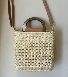 Our Ibiza straw crochet handbag is the perfect addition to your spring/summer wardrobe! This lightweight tote is a must for vacation! Lightweight Straw Woven Handbag Top handles and straps Materials: 100% Paper Straw Drawstring Opening-Polyester Lining Imported Approximately: 7x7.8 in Summer Braided Crochet Shoulder Bag, Braided Crochet Shoulder Bag For Summer, Spring Braided Crochet Tote Bag, Summer Braided Shopping Bag, Summer Braided Shoulder Bag For Shopping, Summer Shopping Braided Shoulder Bag, Summer Shopping Bag With Braided Details, Spring Open Weave Rectangular Shoulder Bag, Spring Braided Straw Bag