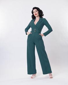 Unleash your inner vintage goddess with the Etta Jumpsuit! With its elegant 1940s-inspired design, this jumpsuit boasts a straight leg design, center seam front and back, and side seam pockets for both style and convenience. The included belt and hidden back zipper add the perfect finishing touches. (Slay in style! 💁‍♀️) Care advise: Wash cold gentle cycle, air dry Fit advise: Fits true to size with 2" stretch Fabric Stretch Poly Vintage Goddess, Border Print, Design Center, Wiggle Dress, Leg Design, Swing Dress, Air Dry, Winter Coat, Dress Collection