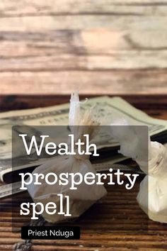 a pile of money sitting on top of a wooden table with the words, health prosperity spell